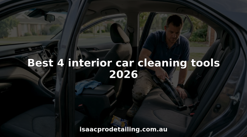 Car detailer cleaning sedan interior with vacuum