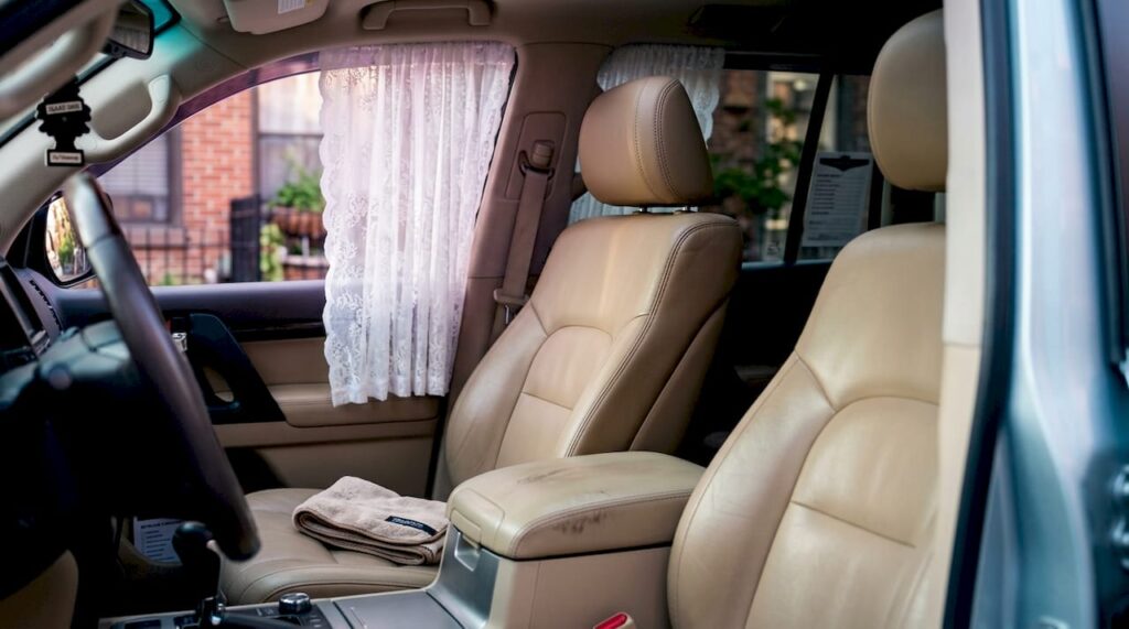 Car leather seat with sunlight filtering through window