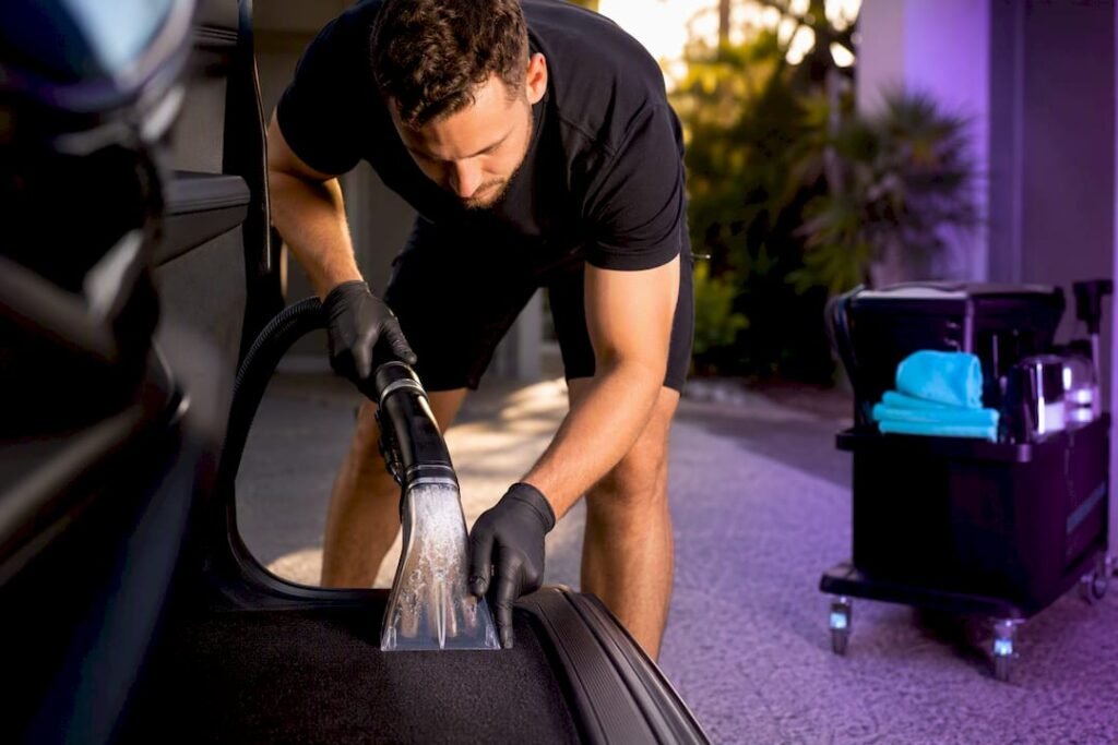 Detailer extracting moisture from car carpet